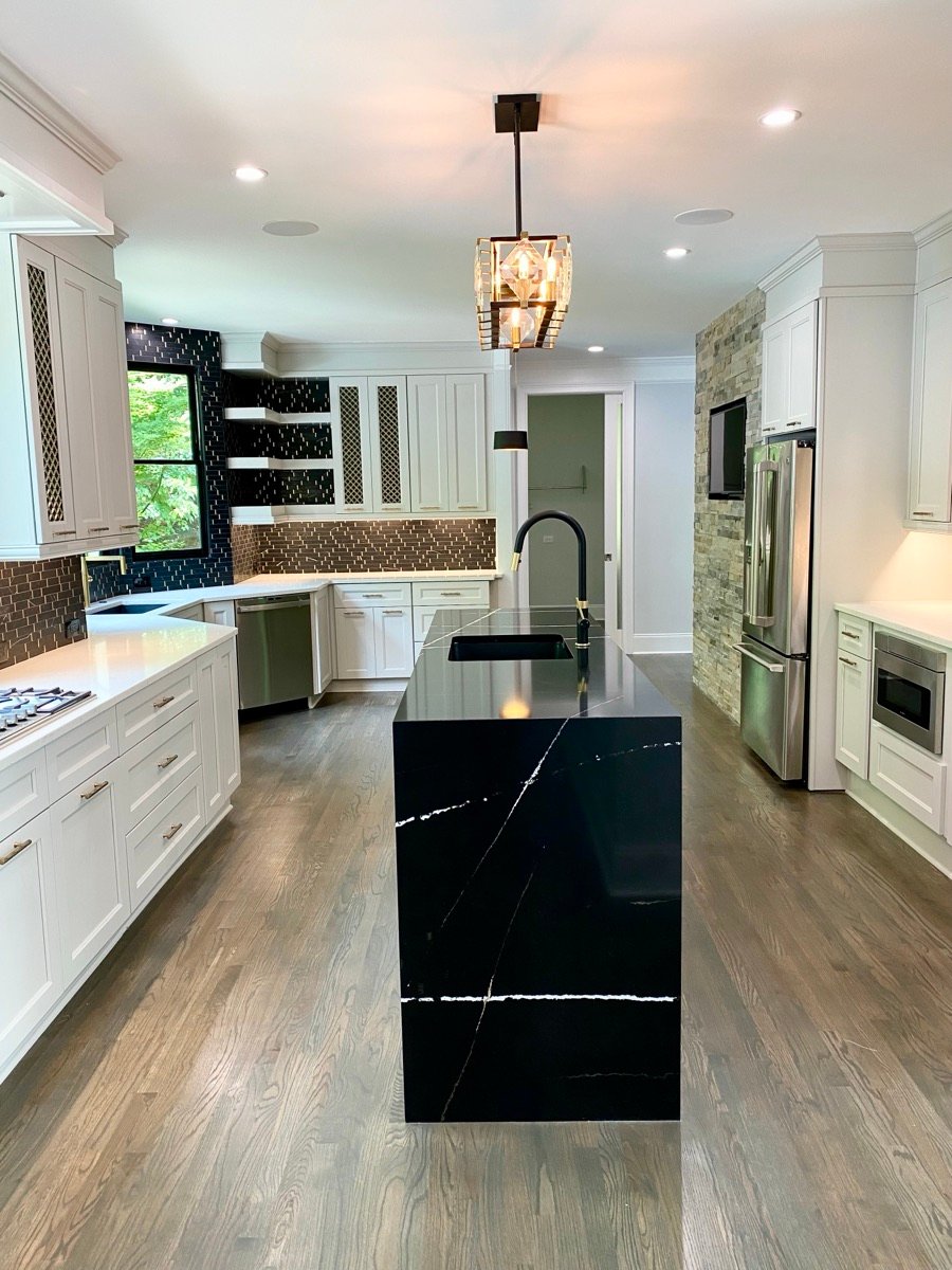 Custom kitchen with waterfall stone island in a GHIR custom home in Dawsonville, GA